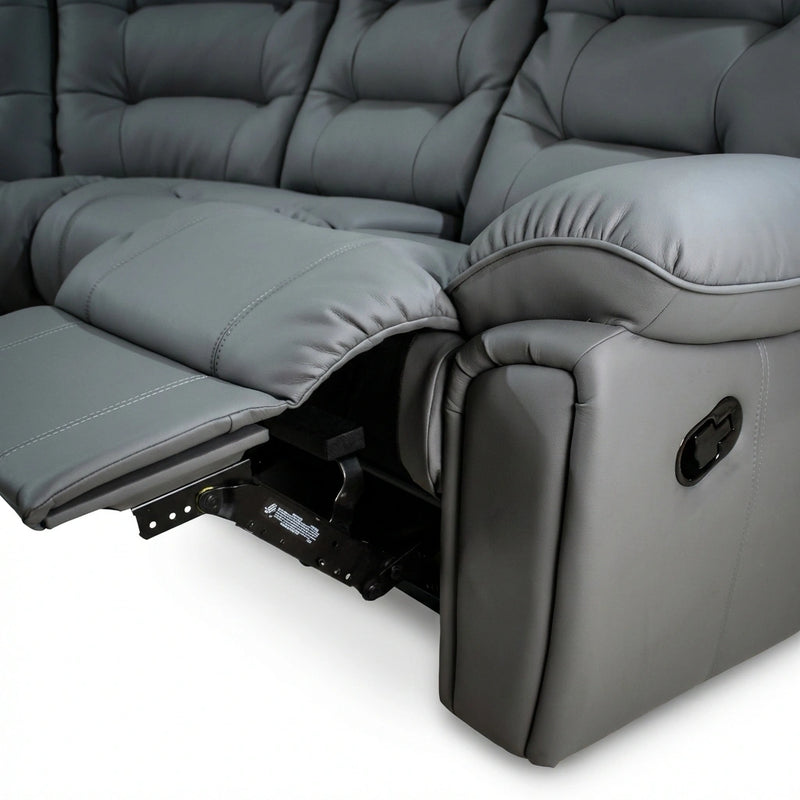 Gray recliner sofa with a visible mechanism on a white background