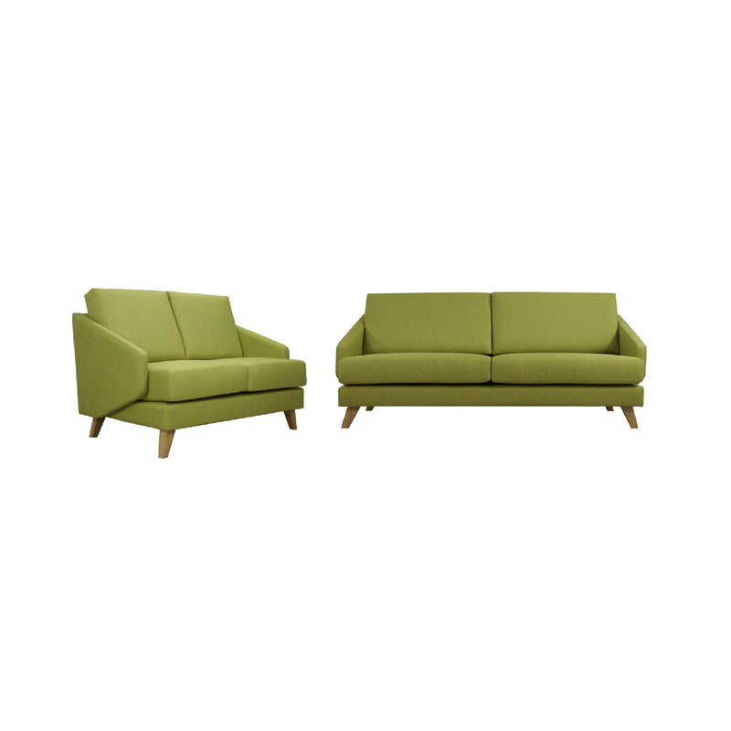 Two green sofas on a white background