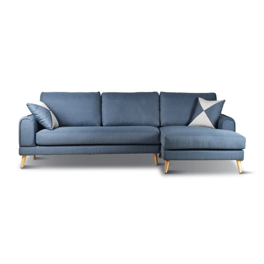 Blue sectional sofa with cushions on a white background