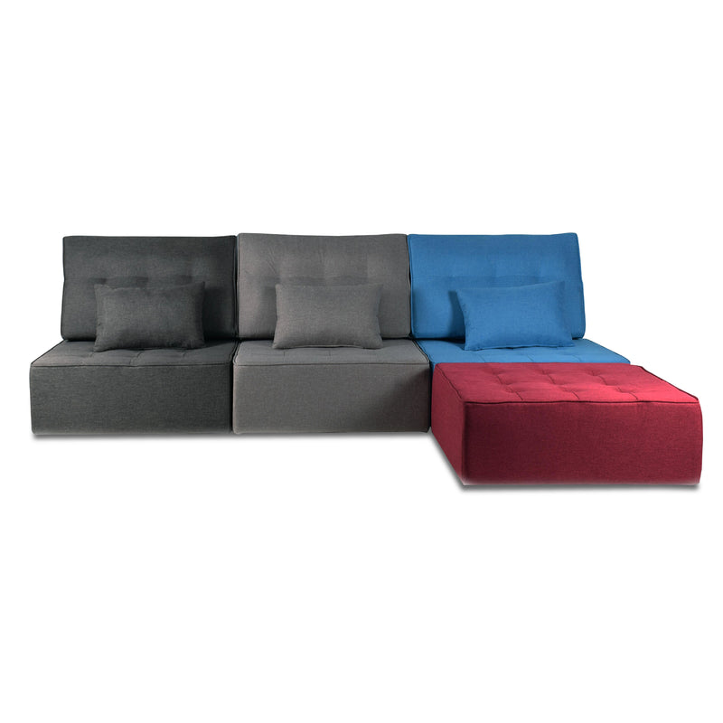 Multicolored modular sofa with a red cube on a white background