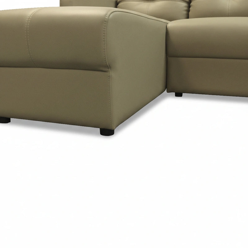 Brown leather sectional sofa on a white background