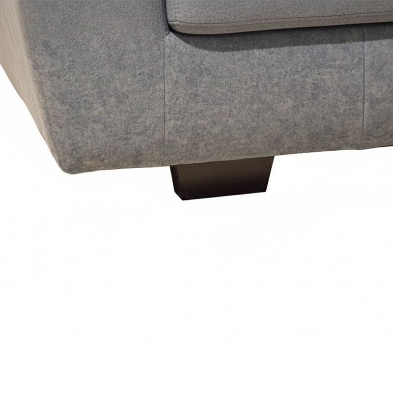 Gray fabric sofa corner with a white background