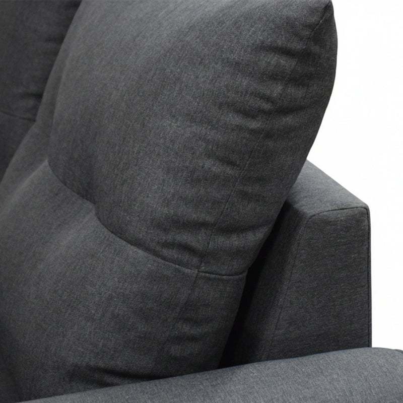 Gray fabric armchair with a pillow on a white background