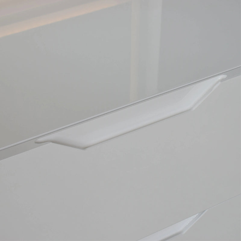 Close-up of a white ceramic tile with a subtle pattern on a light gray background