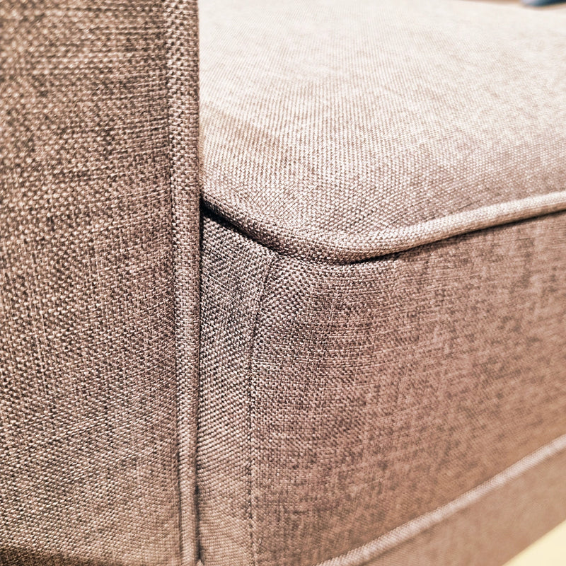 Close-up of a textured brown fabric surface