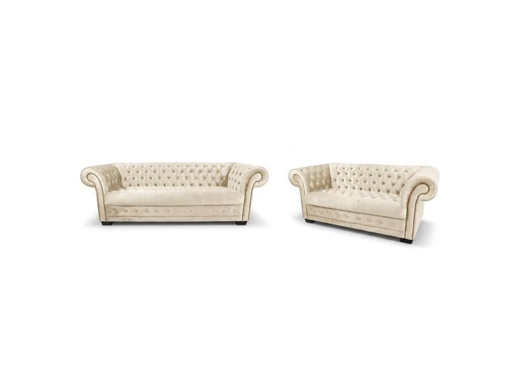 A matching set of two tufted armchairs in cream-colored upholstery, shown against a plain white background.