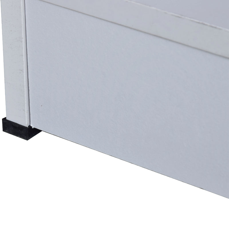 Close-up of a white cabinet with a black base on a white background