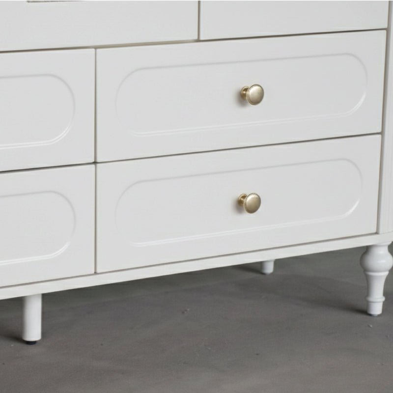 White dresser with gold knobs on a gray floor