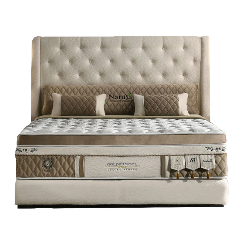 Beige and brown mattress with tufted headboard on a white background