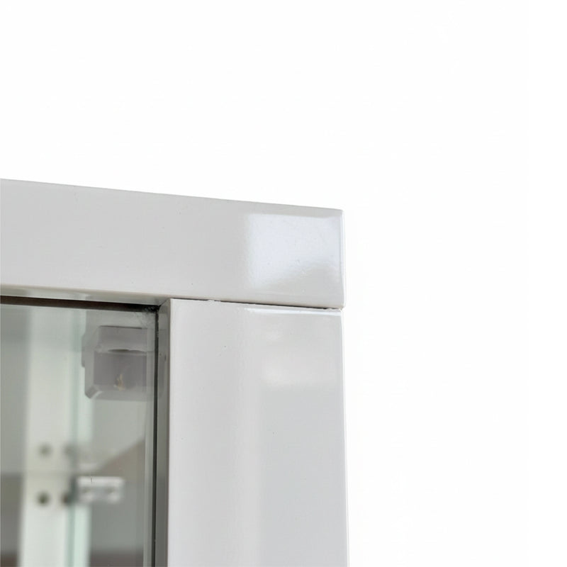 Close-up of a glass door with a metallic handle on a white background