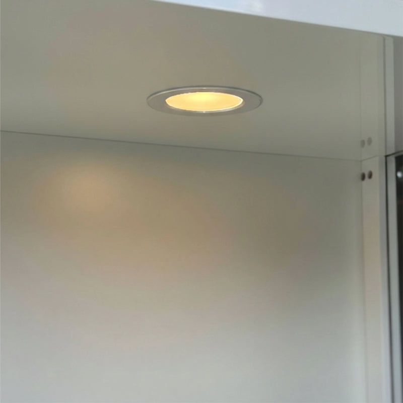Small recessed light fixture on a ceiling