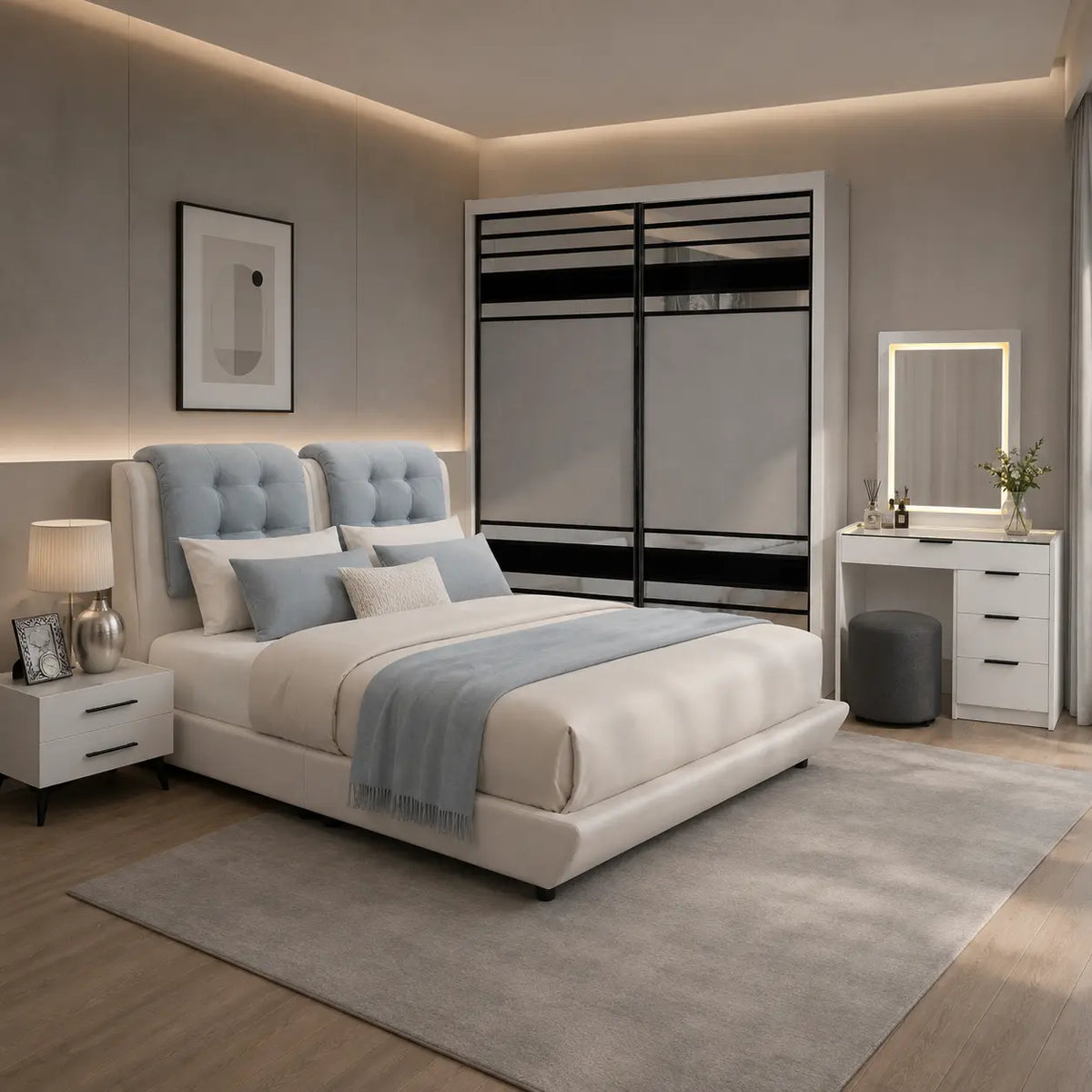 A modern bedroom featuring a light beige upholstered bed with a tufted light blue headboard, styled with white and blue bedding. The room includes a matching light gray rug, a white vanity table with a mirror, a white nightstand, and a large white sliding wardrobe with black accents.