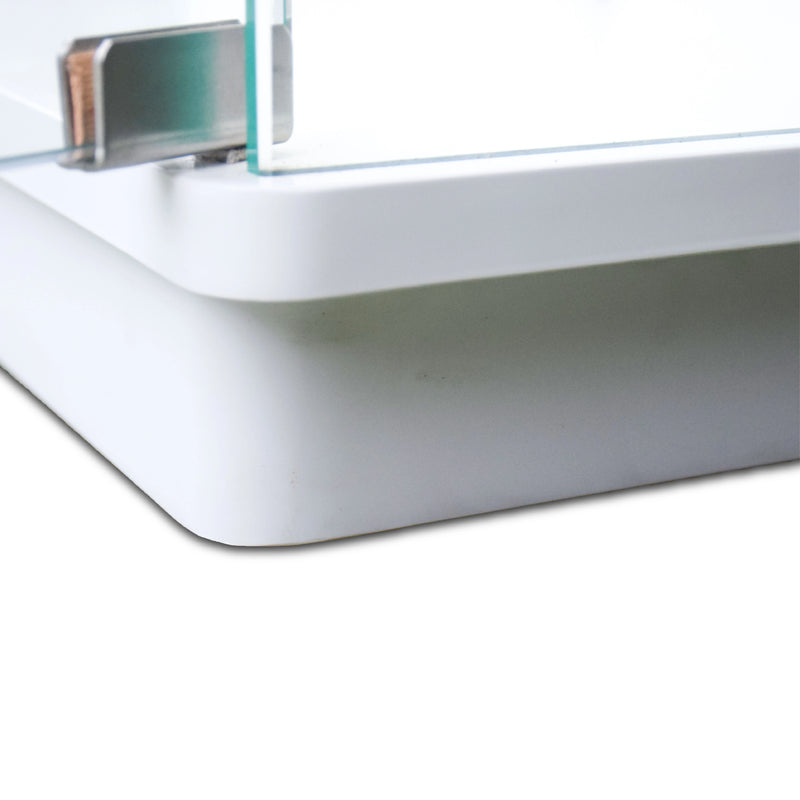 Close-up of a metallic object with a reflective surface on a white background