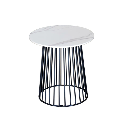 Small round table with a white marble top and black metal base on a white background
