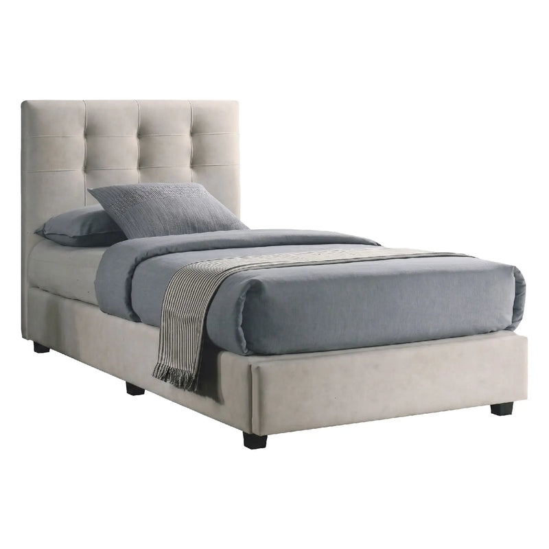 Beige upholstered bed with gray bedding on a white background