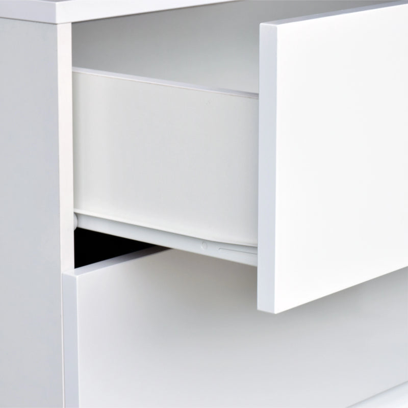 White office desk with a drawer open on a light gray background