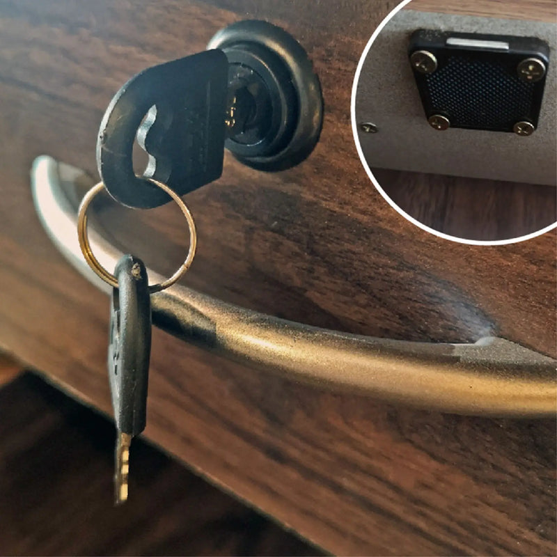 Close-up of a key inserted into a wooden door handle lock with an inset showing the lock mechanism.