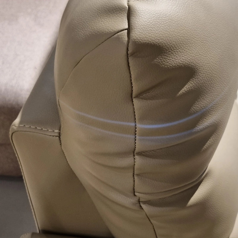 Close-up of beige leather car seat with stitching details