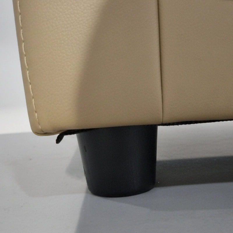 Close-up of a beige sofa with a black leg