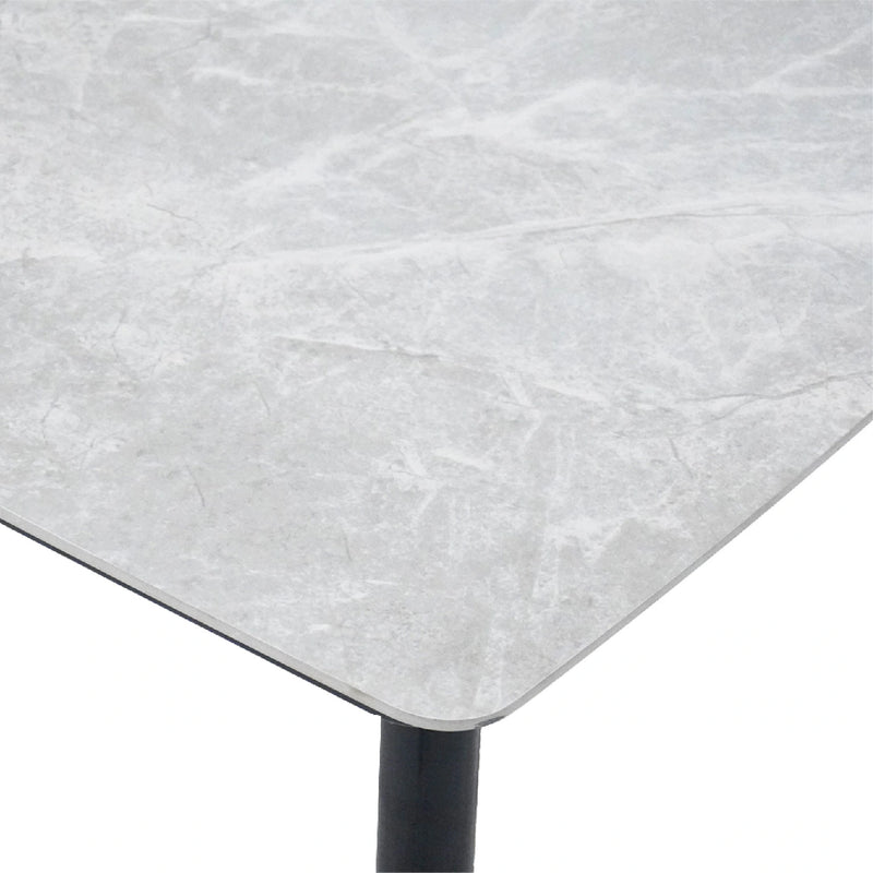 Close-up of a gray marble table surface with a white background