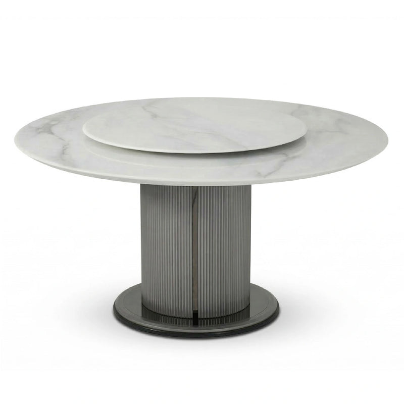 Round marble table with a metallic base on a white background
