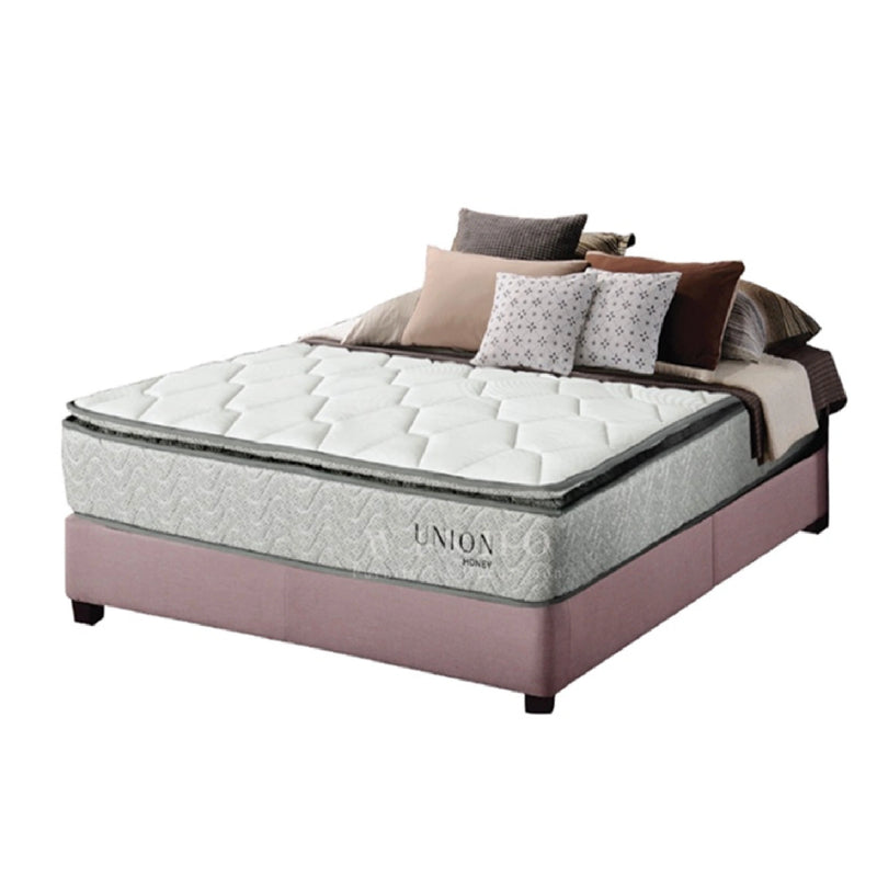 Mattress with bedding set on a white background