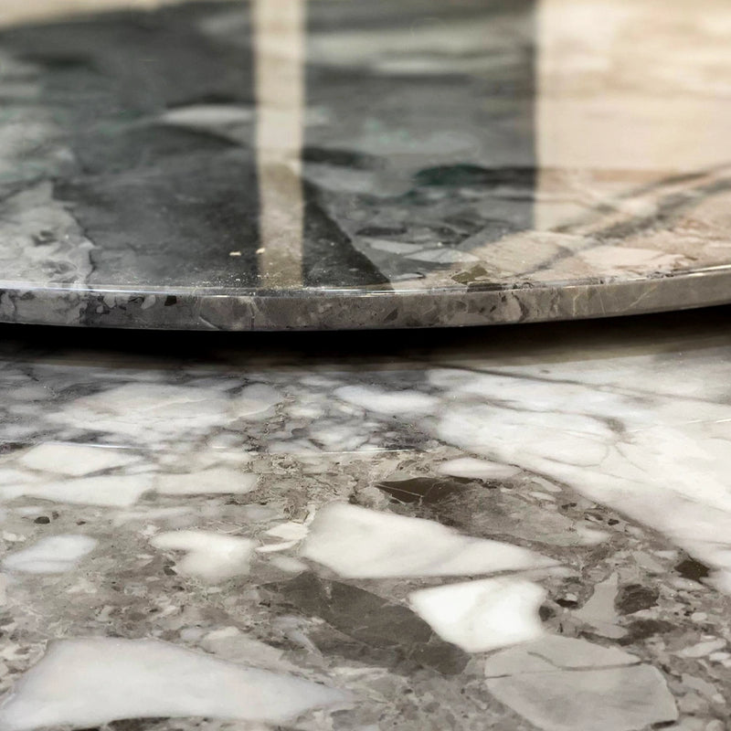 Close-up of a marble surface with a pattern of gray, white, and black.