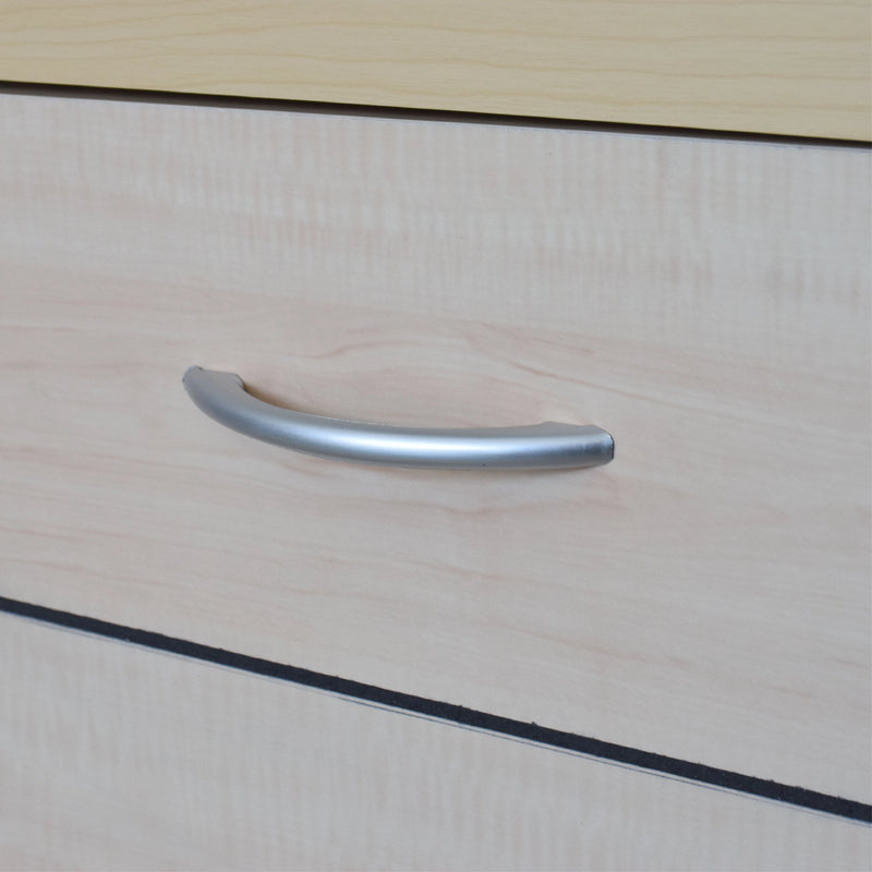 Metallic handle on a wooden surface