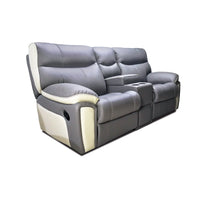 Gray reclining sofa with white accents on a white background