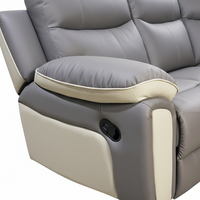 Gray recliner chair with beige armrest on a white background