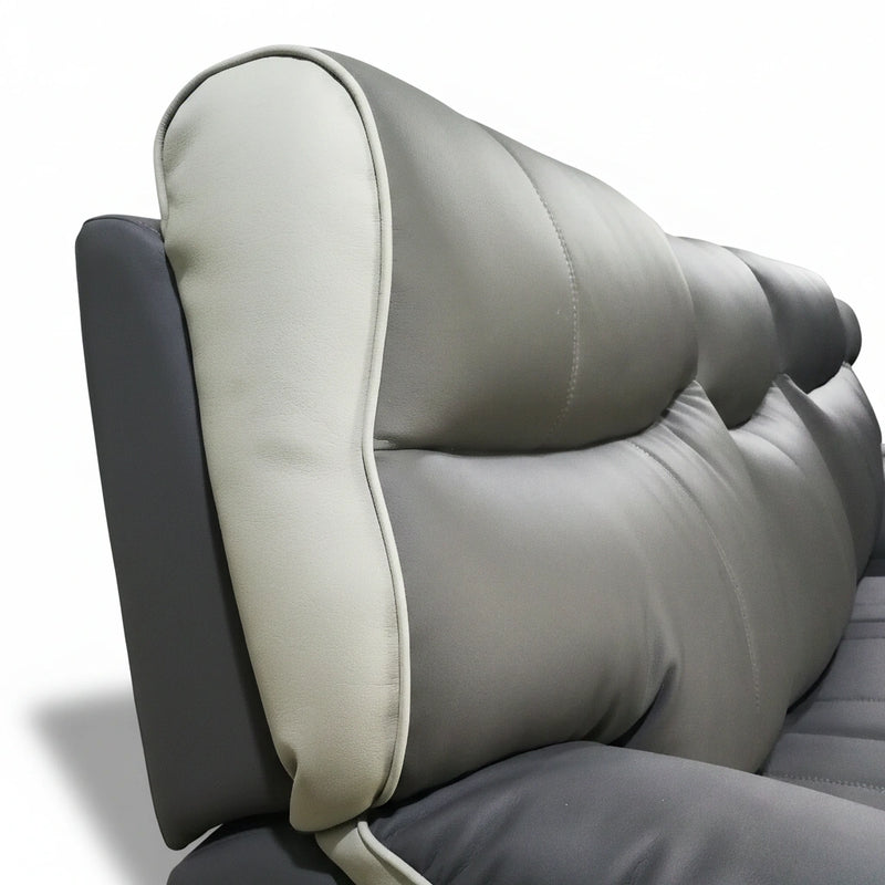 Gray leather sofa with headrest on a white background