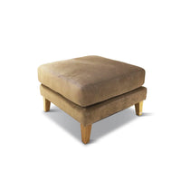 Brown ottoman with wooden legs on a white background