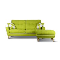 Green sofa with matching ottoman on a white background