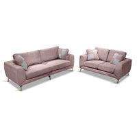 Pink sofa set with gray cushions on a white background