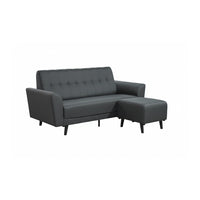 Gray sectional sofa with ottoman on a white background
