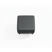 Black cube-shaped ottoman on a white background