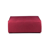 Red fabric ottoman on a white background
