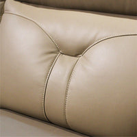 Close-up of beige leather car seat with stitching detail