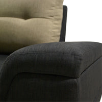 Close-up of a dark gray upholstered chair with a beige cushion.