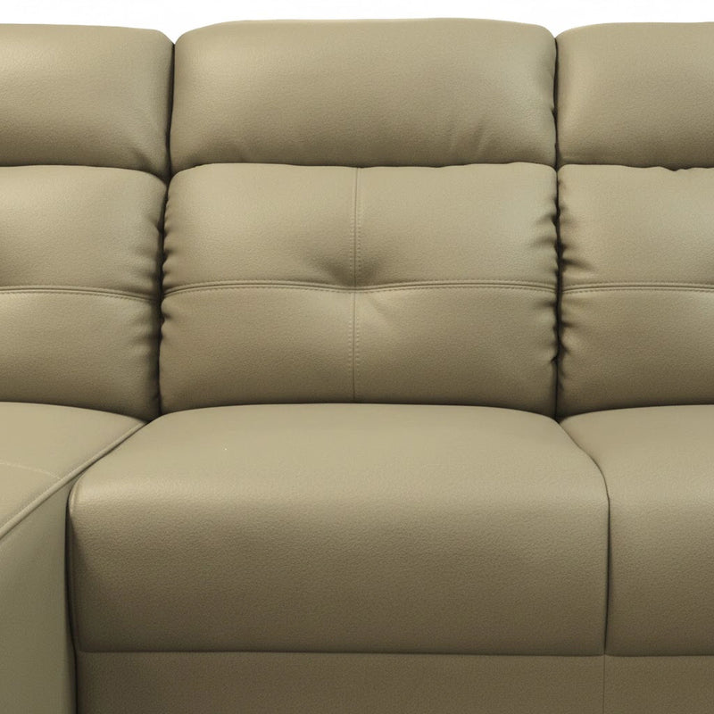 Beige leather sectional sofa with a close-up view of the cushions.