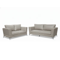 Two beige leather sofas