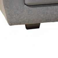 Gray fabric sofa corner with a white background