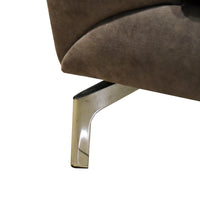 Close-up of a brown upholstered chair with a shiny metal leg on a white background
