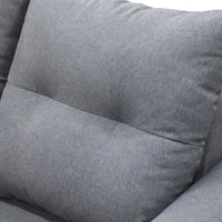 Close-up of a gray fabric sofa with cushions