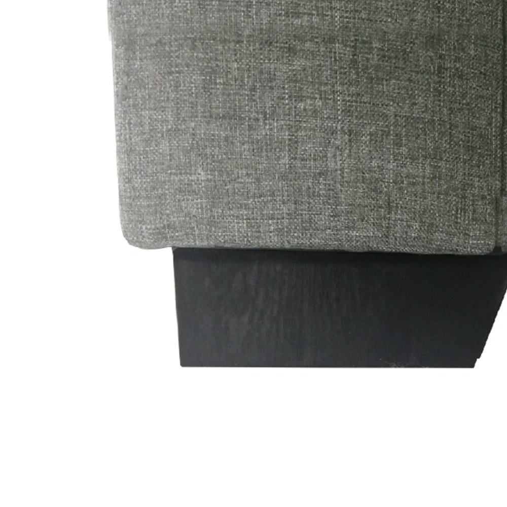 Close-up of a gray fabric surface with a subtle pattern on a white background