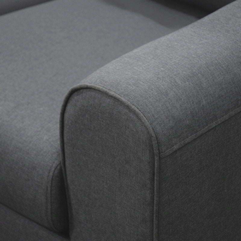 Gray fabric surface of a sofa with a focus on texture and color.
