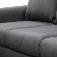 Gray fabric sofa with a pillow on a white background