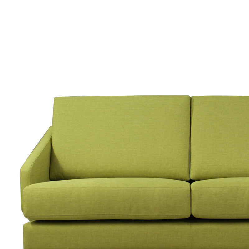 Green sofa on a white background