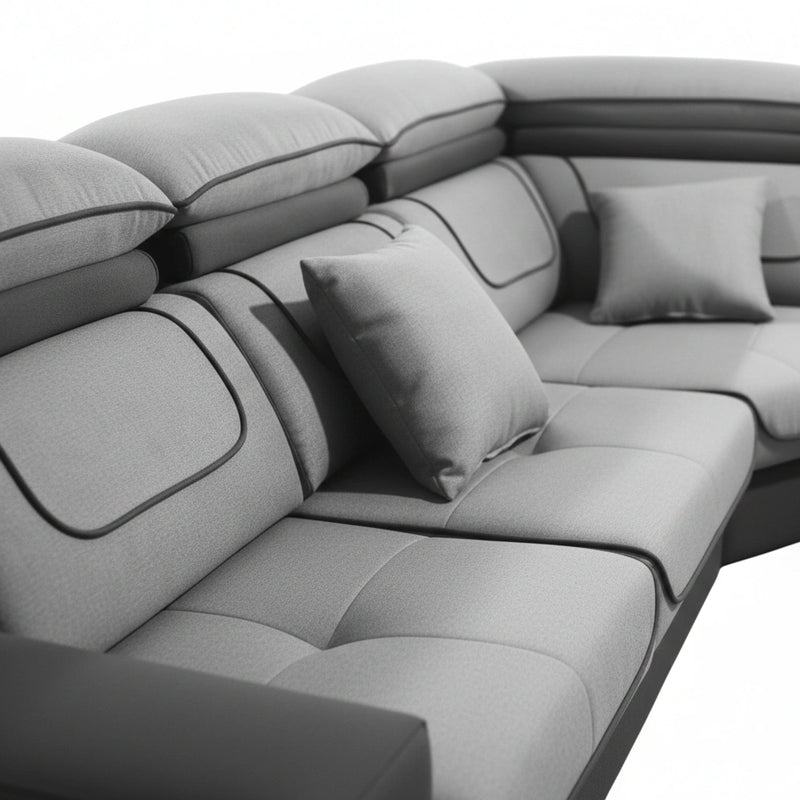 Gray sectional sofa with cushions on a white background