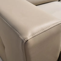 Close-up of beige leather car seat with stitching detail